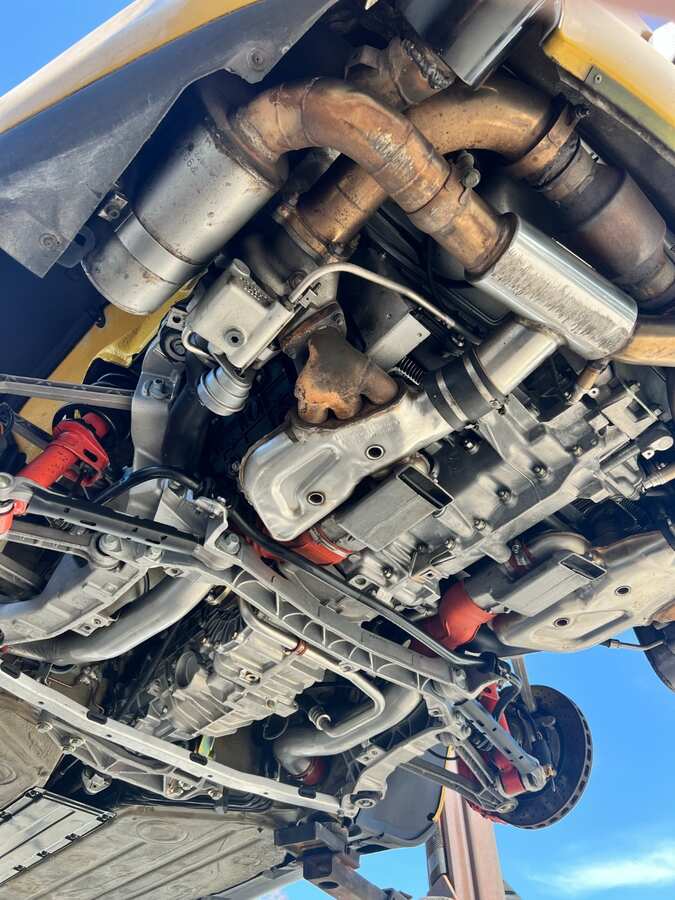 Porsche undercarriage after dry ice blasting — factory-clean result by Ice Blast Works