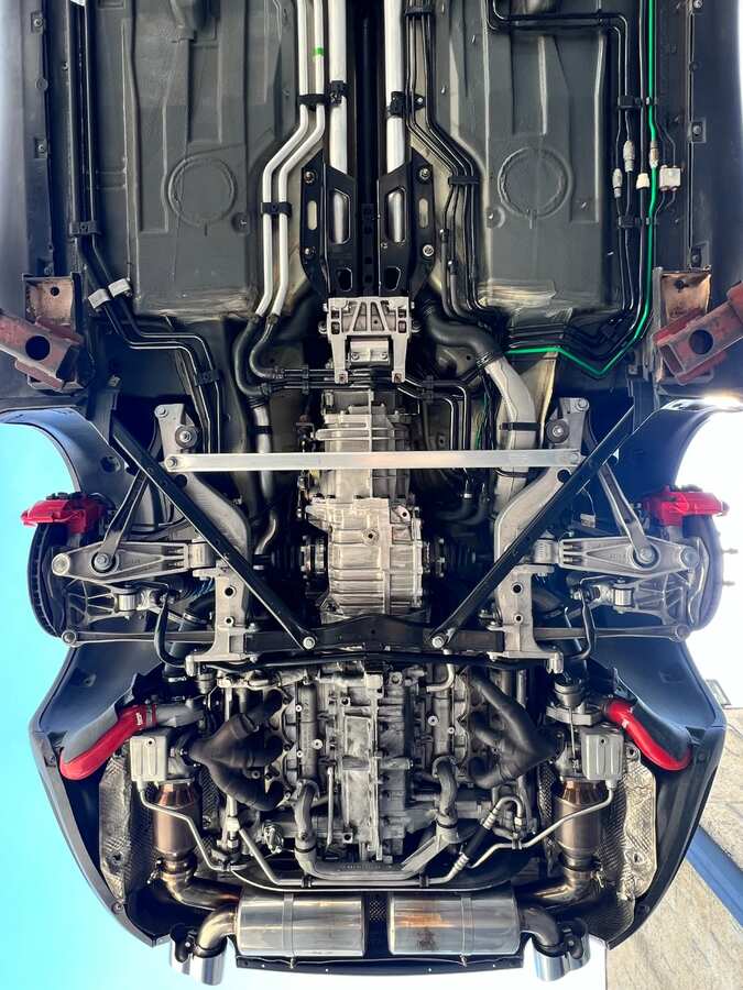 Exotic sports car full chassis after dry ice blasting — pristine black finish