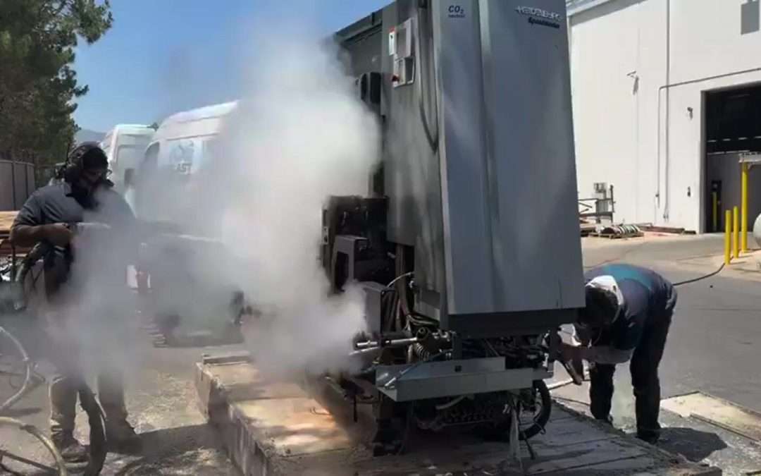 Ice Blast Works technician performing dry ice blasting on an active job site